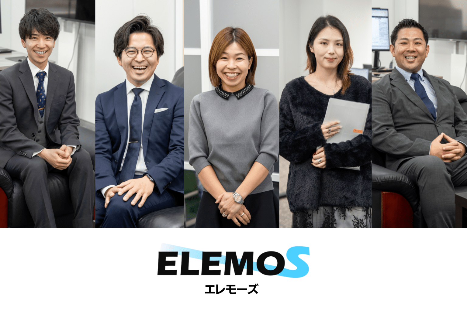 Five smiling professionals in business attire posing together in an office setting for a group photo.