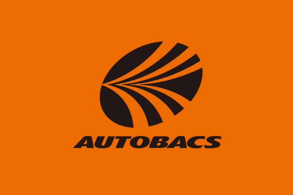 Autobacs logo: black abstract leaf on an orange background